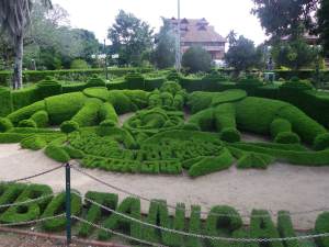 Seal of Kerala in the front, Napier museum in the back