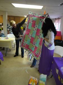 An absolutely gorgeous quilt made by my mom's friend. It has little elephants on it.