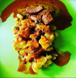 Photo showing the Kerala delicacy, kappa and meen curry. 